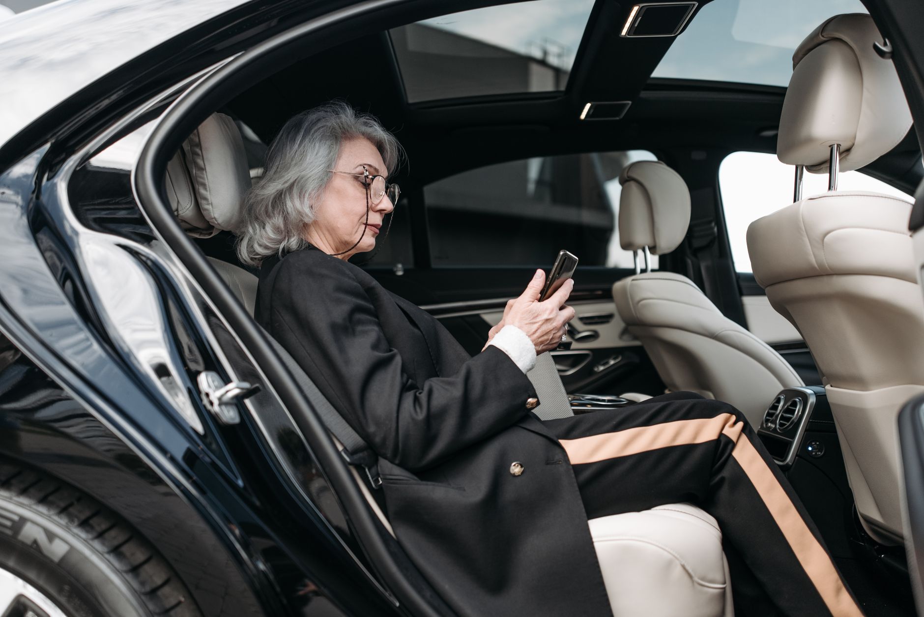 Passenger seated in the rear of a car